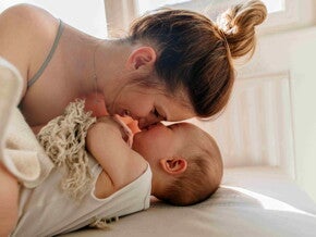 A baby massage can help your child rest and rest better when he sleeps. A mom and her child bonding after a baby massage.