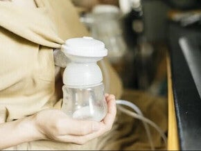 Women using a breast pump in a public place.