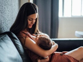 A mother breastfeeding her child