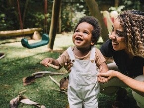 A baby with her mother during family games