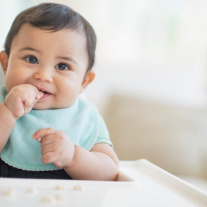 A baby after feeding with reflux symptoms.