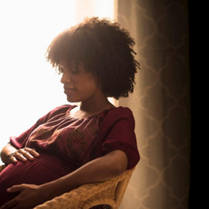 A mother with her newborn after an episiotomy.