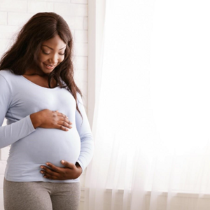 A pregnant lady after taking folic acid in pregnancy.
