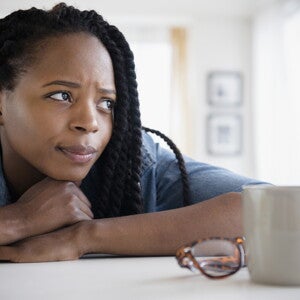 A mother feeding her baby and dealing with postpartum depression.