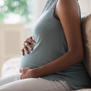 A healthy pregnant lady thanks to her prenatal vitamins.