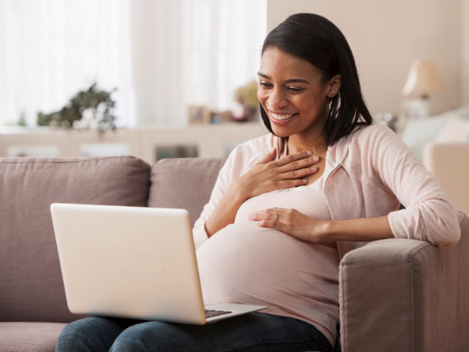 A pregnant woman reading the result of her amniocentesis test.