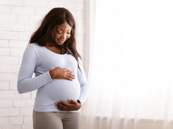 A pregnant lady after taking folic acid in pregnancy. 