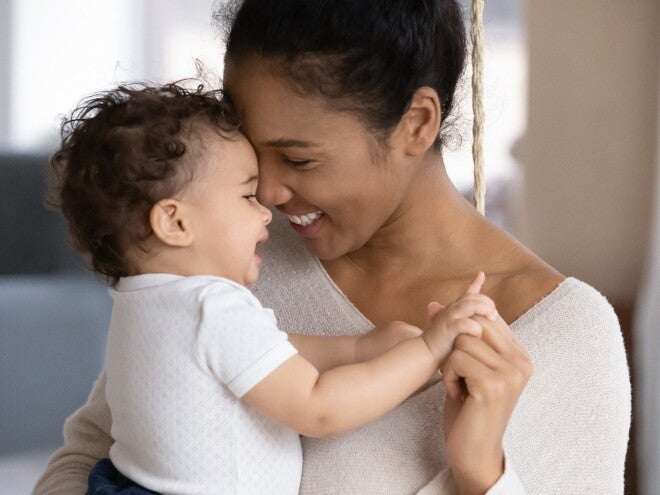 You must pay careful attention to your new mom emotions. A mother holding her baby filled with new mom emotions.