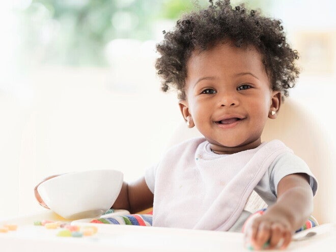 Learn how to help your baby with the most common teething symptoms A child smiling during their teething symptoms