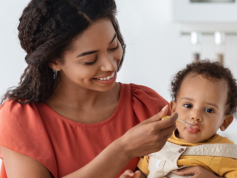 mother feeding her baby