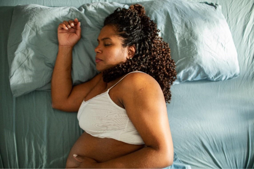 A woman resting to after the first trimester anxiety