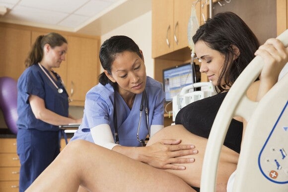 A pregnant woman having the first signs of labor