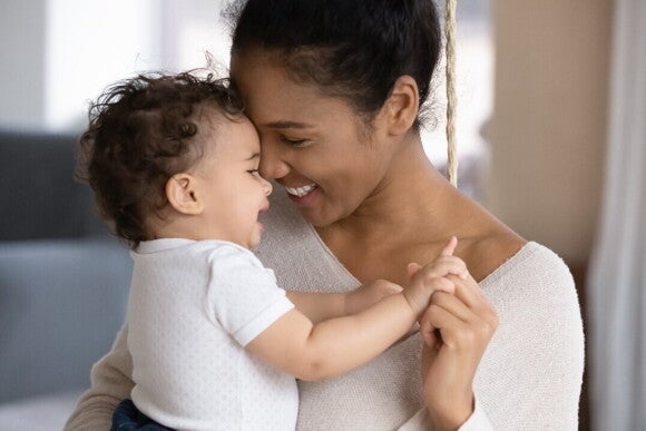 Its important as a parent to be ready for baby teething A mother with her child after helping him with baby teething symptoms
