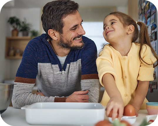 We provide expert nutrition advice, personalized tools, and parental support. Daughter cooking with her dad