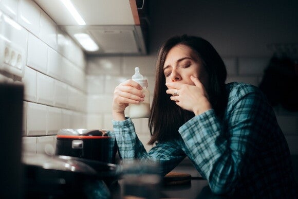 You may feel overwhelmed by sleep depravation A mother dealing with sleep depravation and her new mom emotions